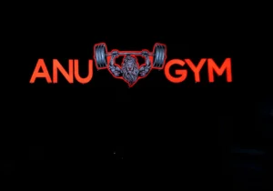 ANU Gym Illuminated Storefront Signage at night